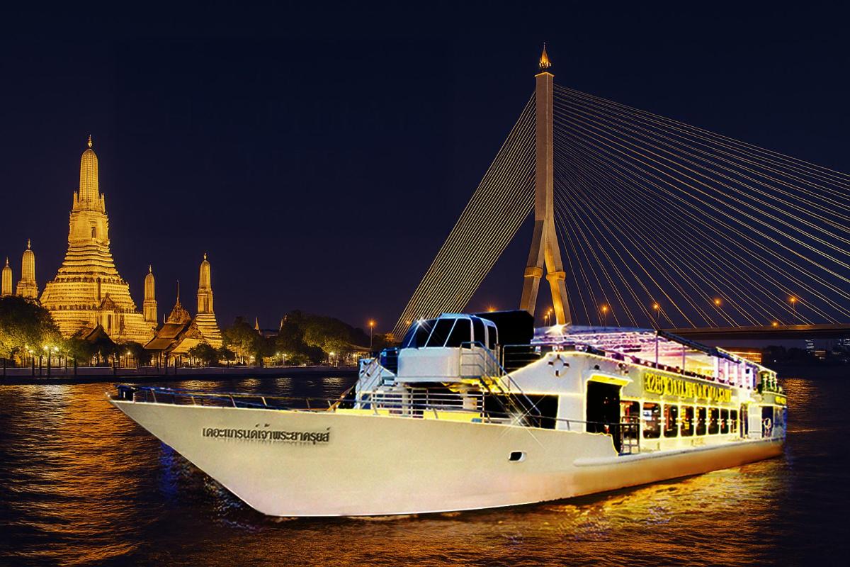 a boat in the water next to a bridge