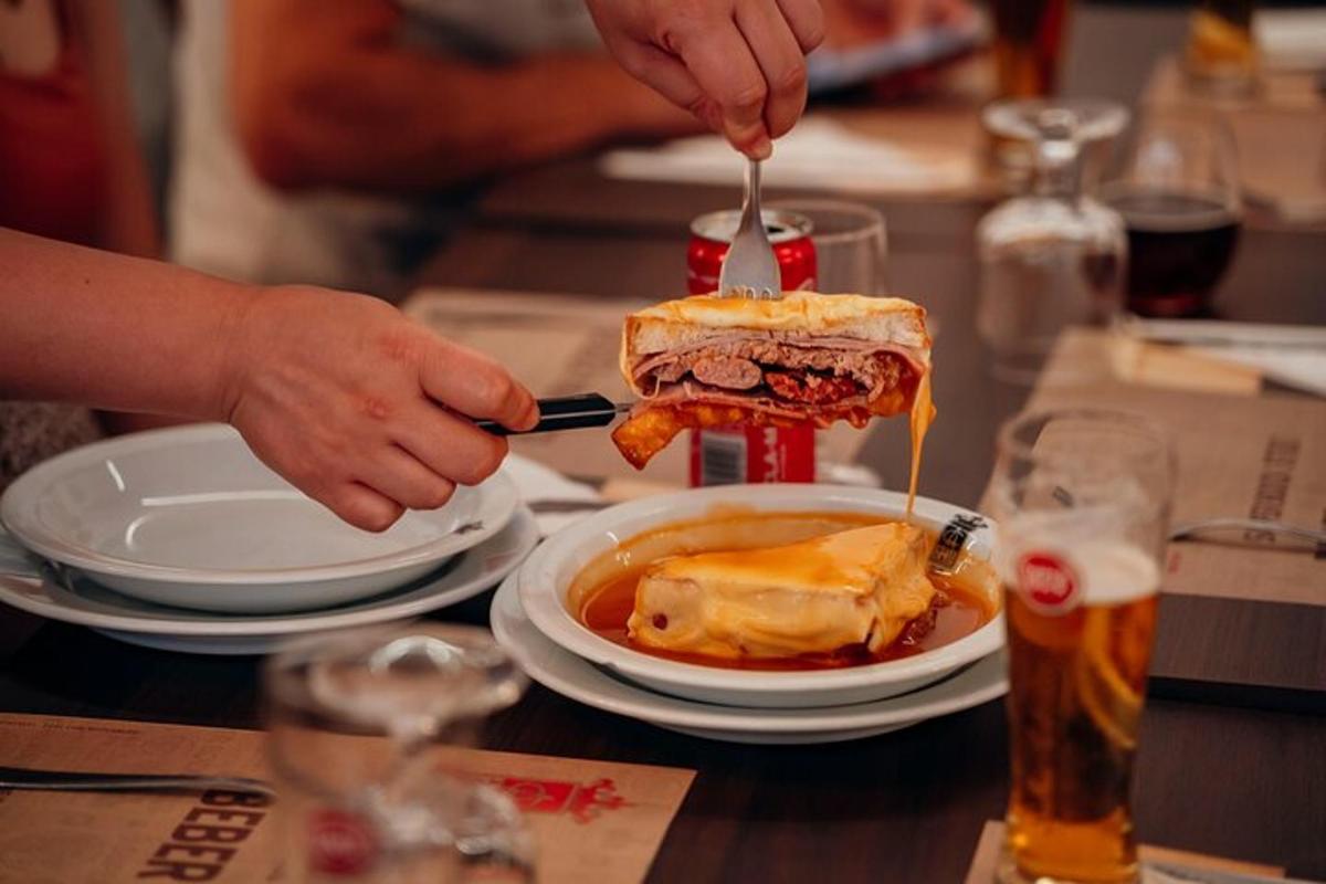 a person is eating a sandwich on a table