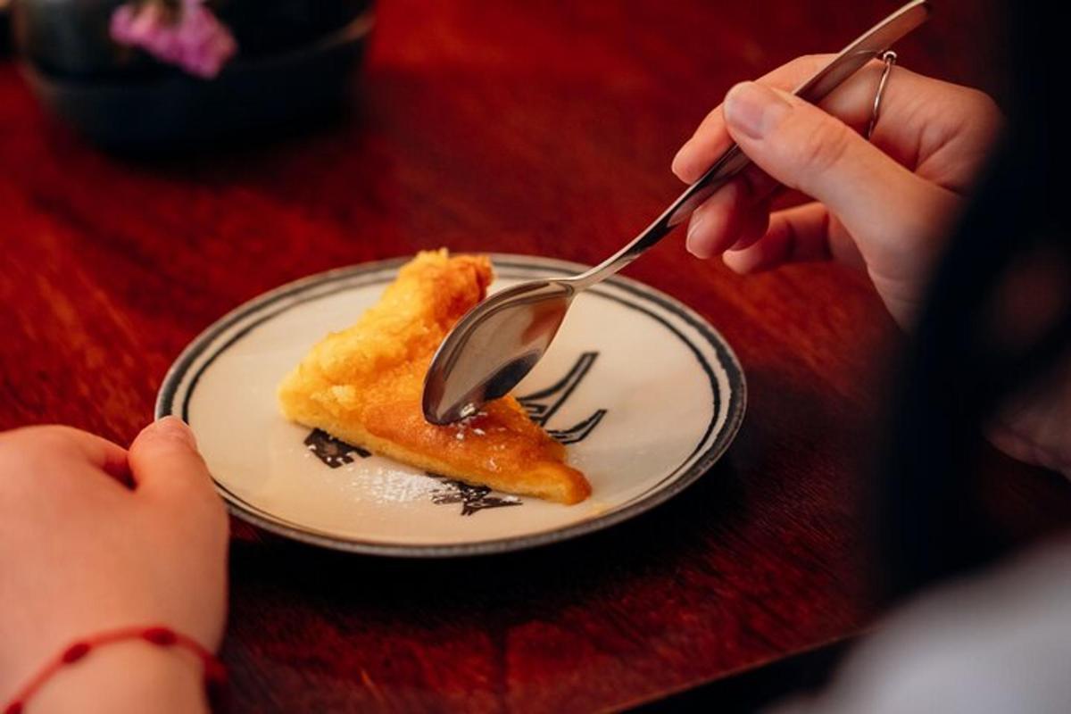 a person is eating a piece of food on a plate