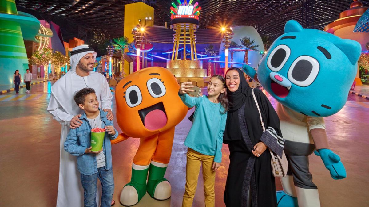 a family posing for a picture in a ride at a theme park