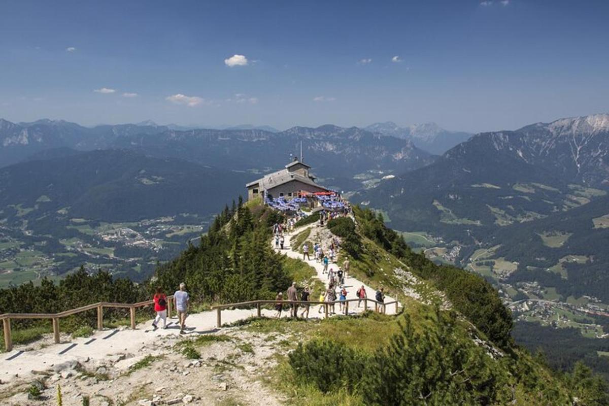 a group of people standing on top of a mountain