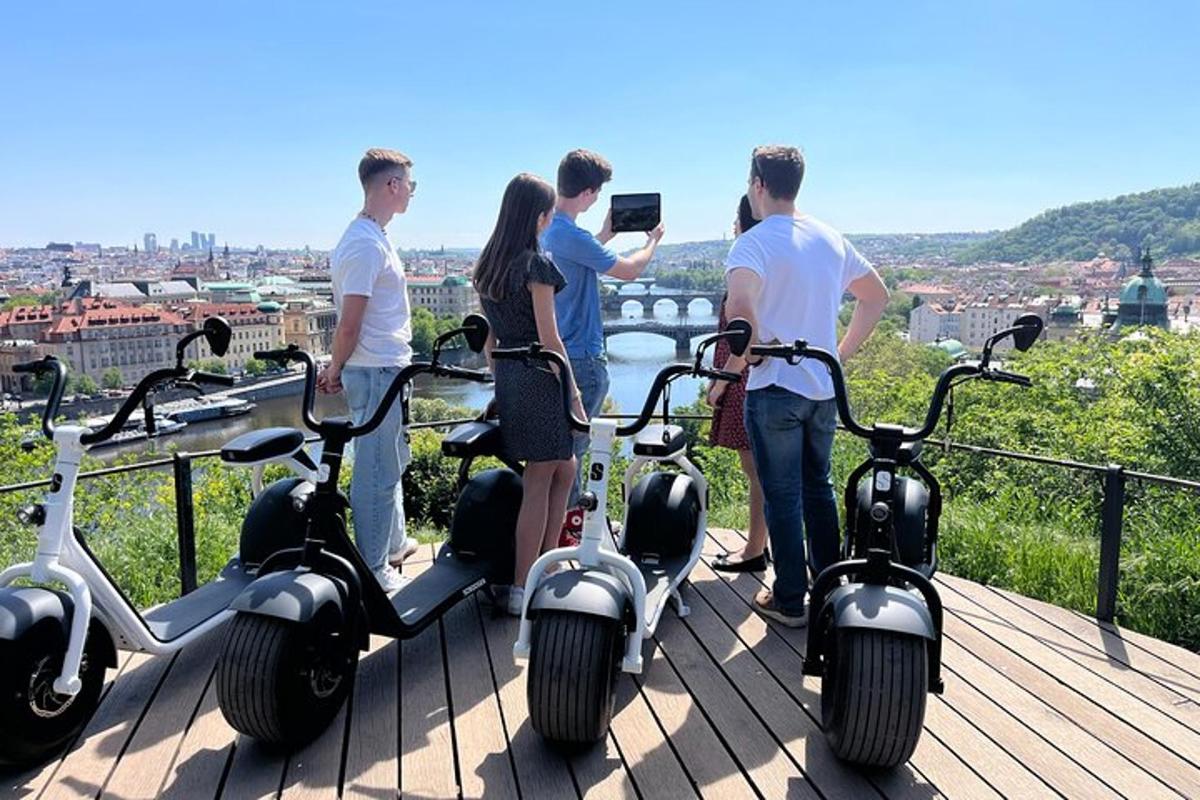 a group of people taking a picture with scooters