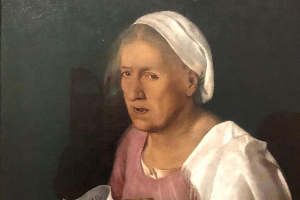 maal naisest, kellel on rätik peas