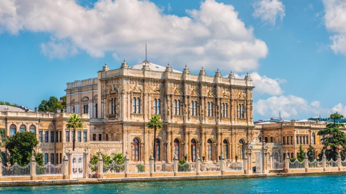 a large building with water in front of it