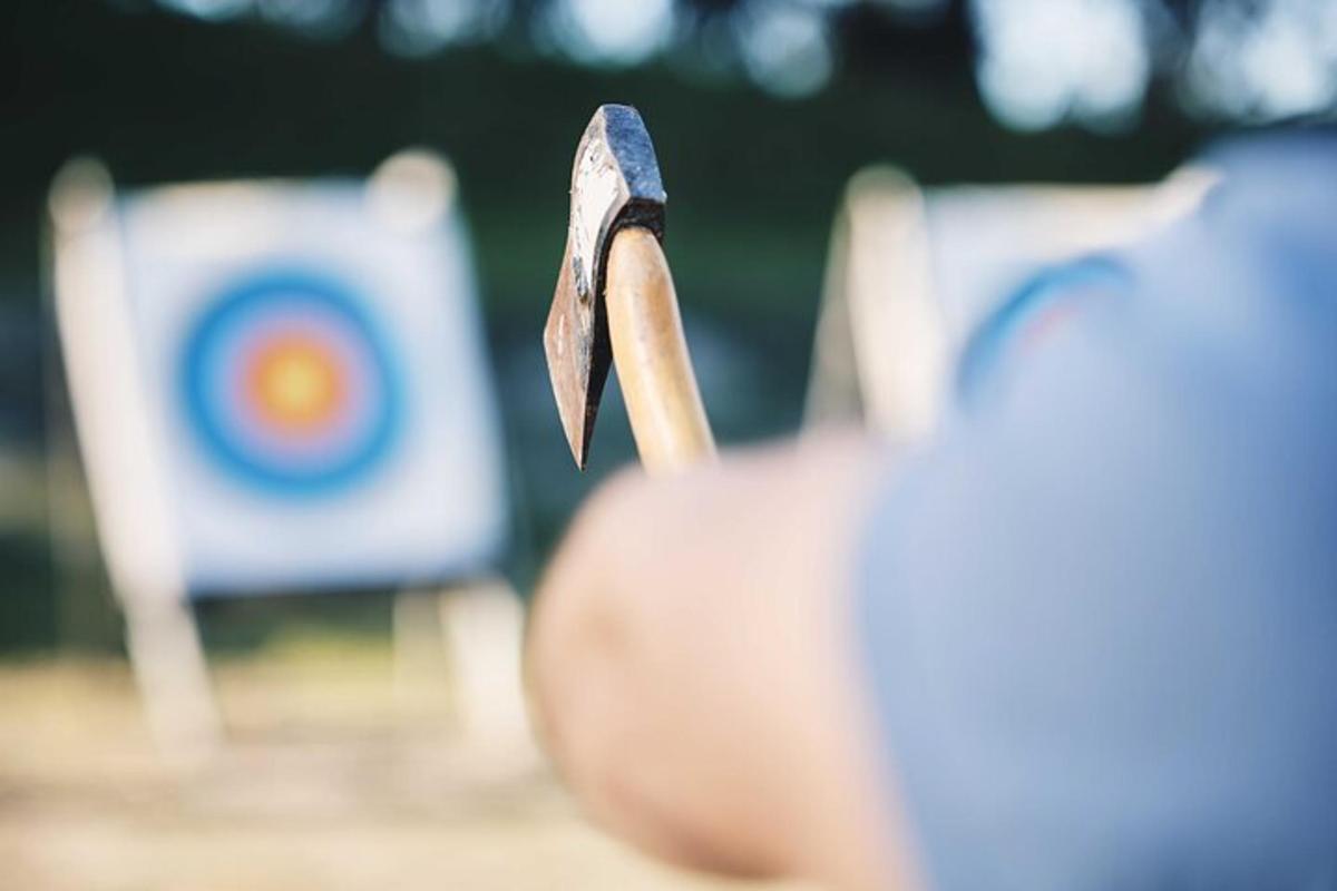 a person holding a stick in front of a target