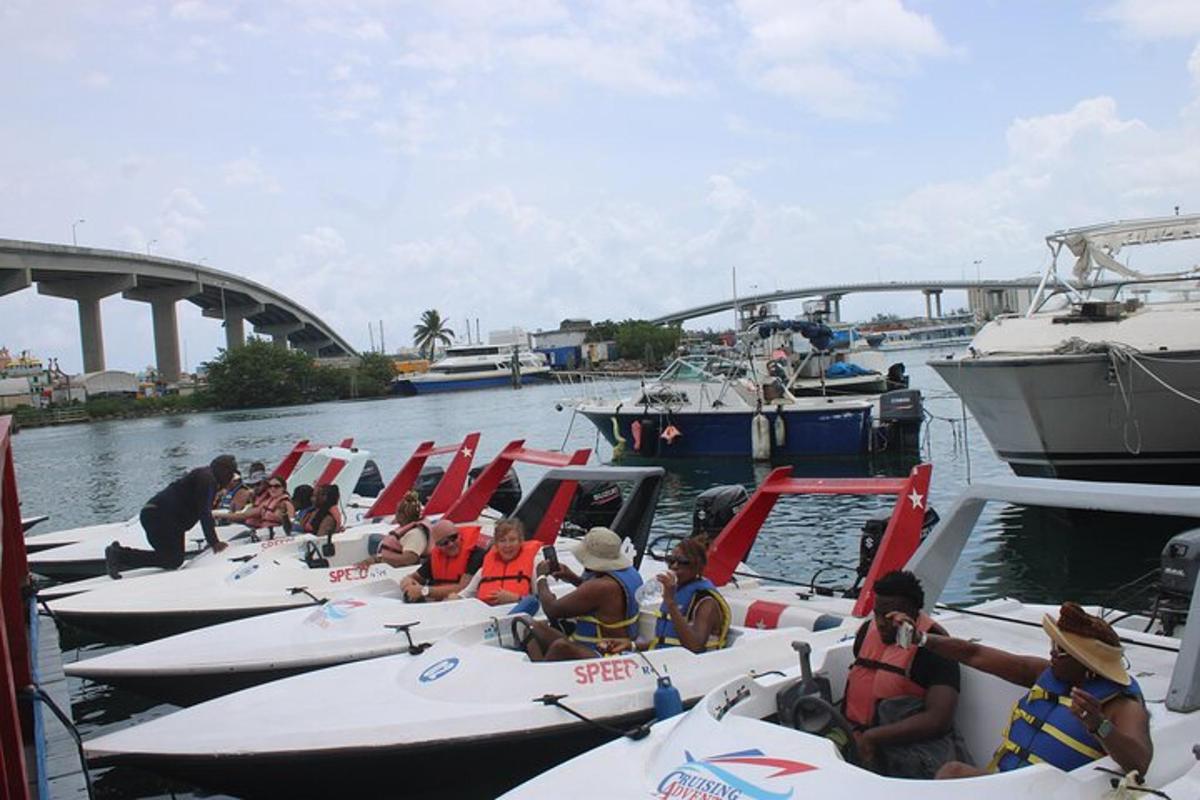 a group of people sitting on boats in the water