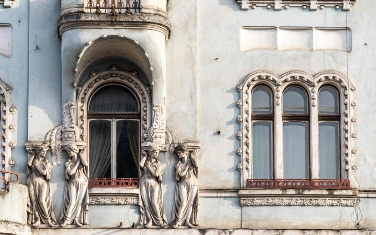 a building with statues on the side of it