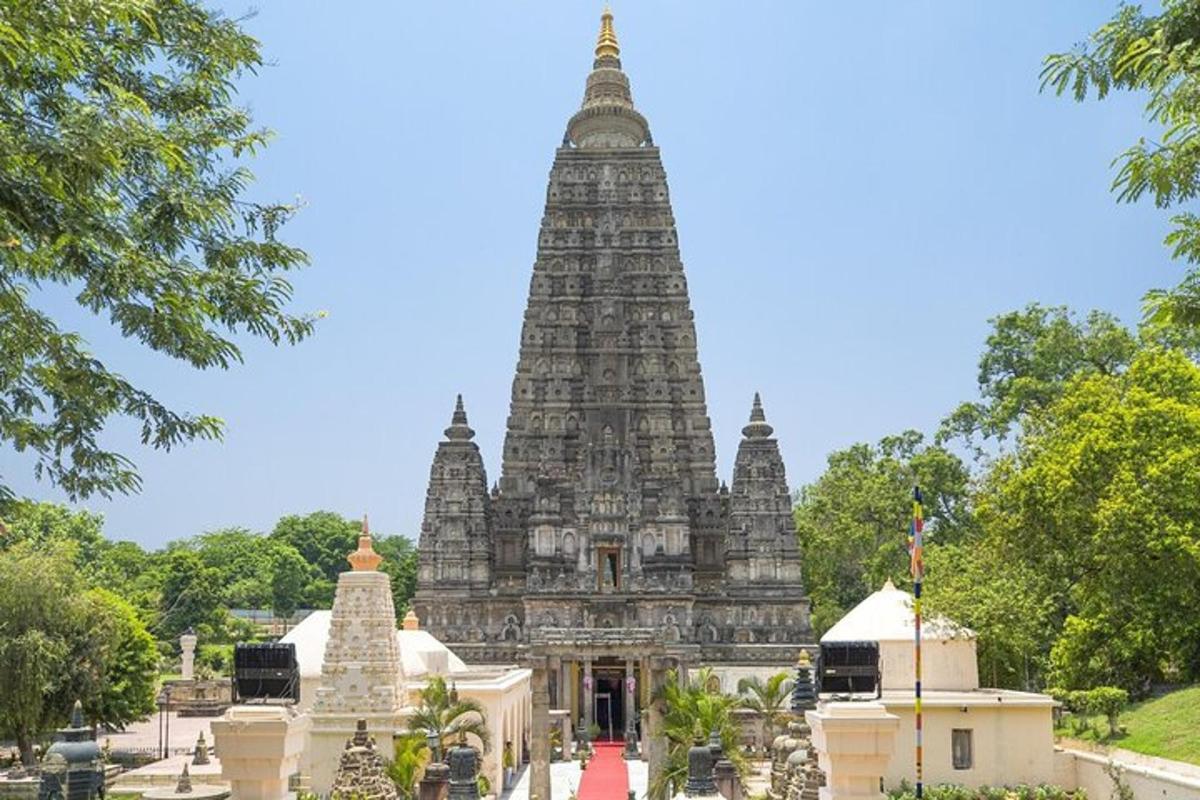 a temple with a tall tower in the background
