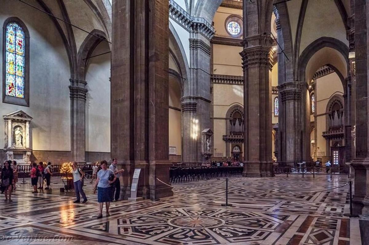 a large cathedral with people standing in a large room
