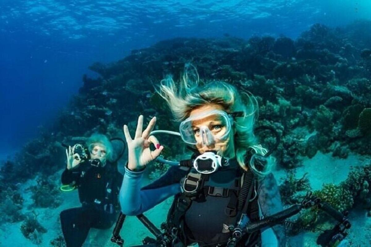 two people are scuba diving in the ocean