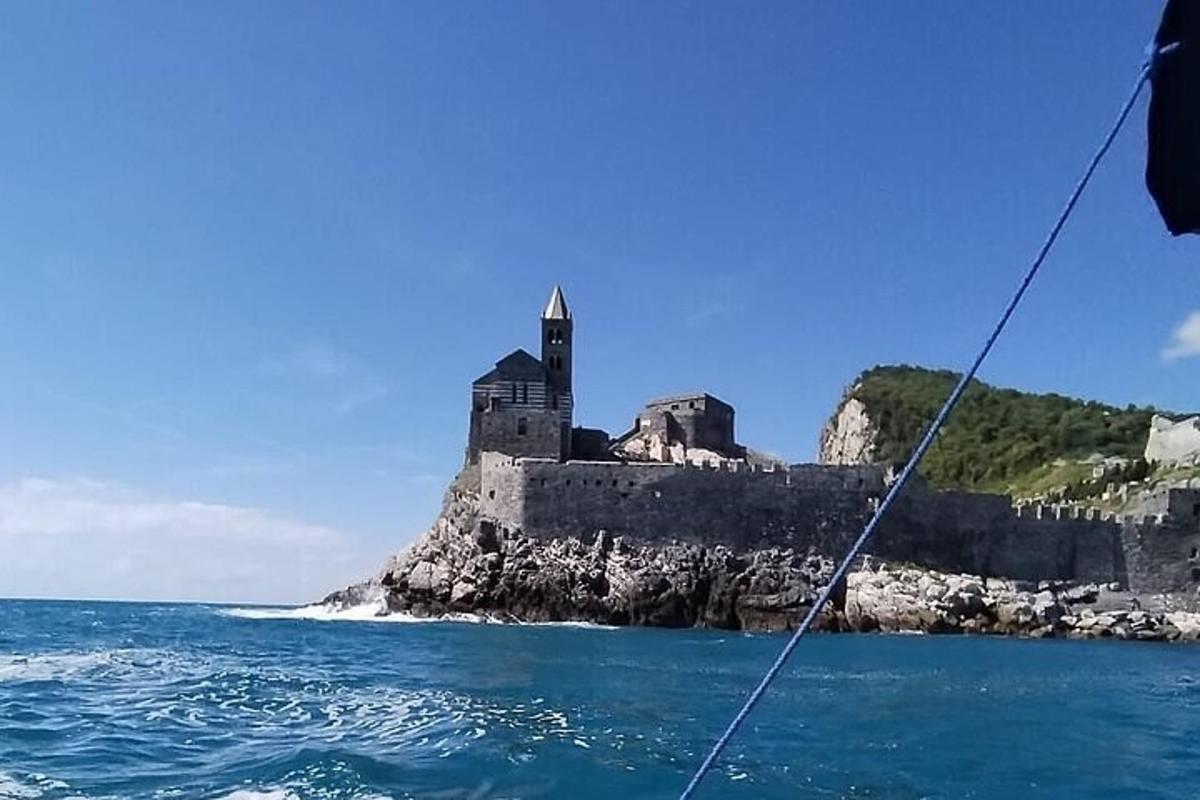 a view of a castle from a boat in the water