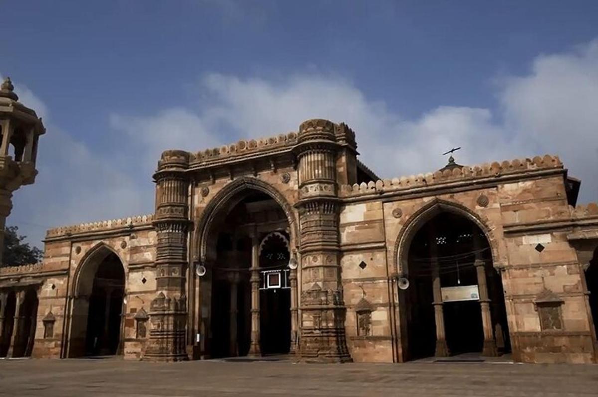 a large stone building with arches on the front