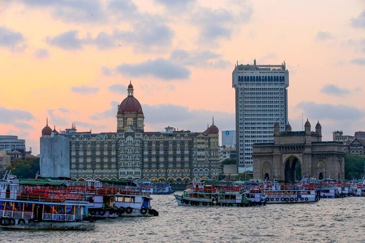 a group of boats in the water in front of buildings