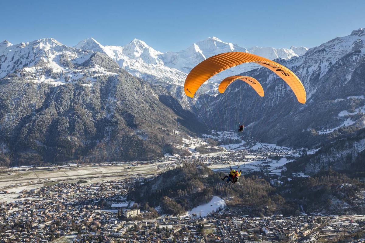 a person para sailing in the air with a parachute