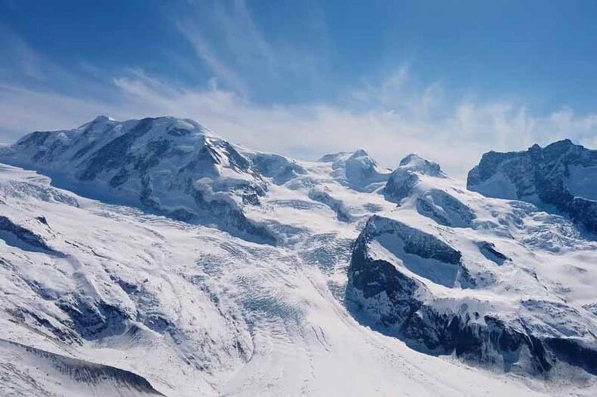 an aerial view of a snow covered mountain