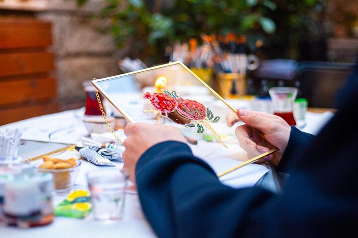 a person holding a picture of a table with chopsticks