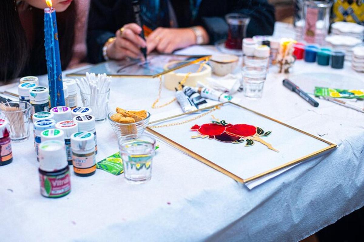 a table with a painting of flowers on it