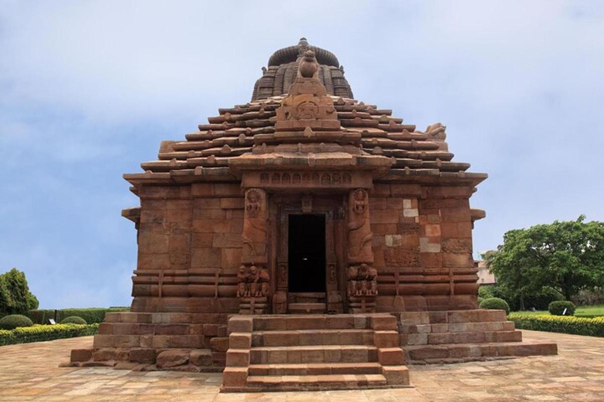a large stone building with a doorway in a park