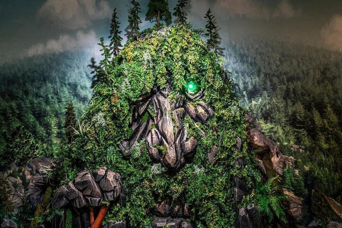 a painting of a tree stump with vegetation on it