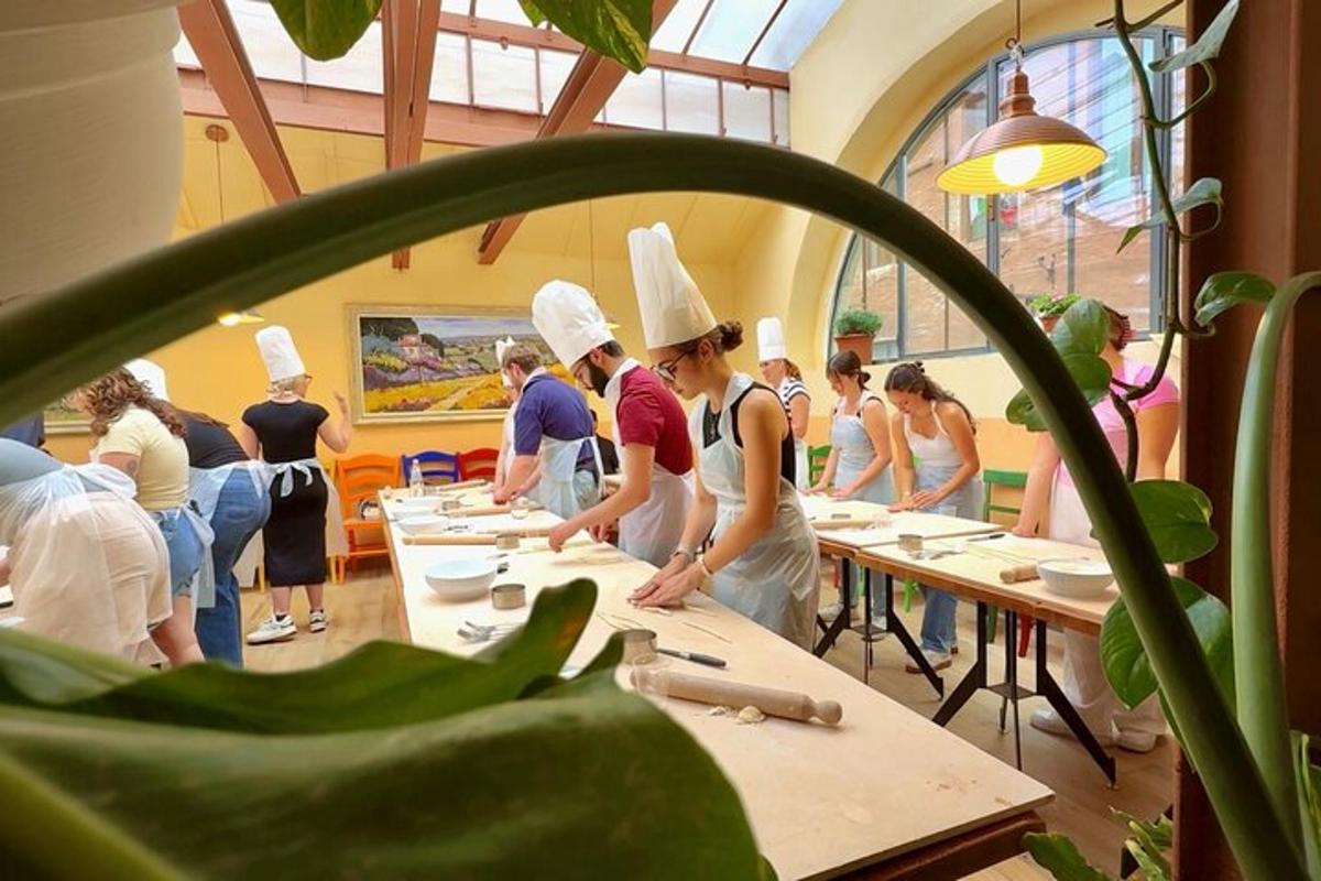 a group of people wearing chefs hats in a room