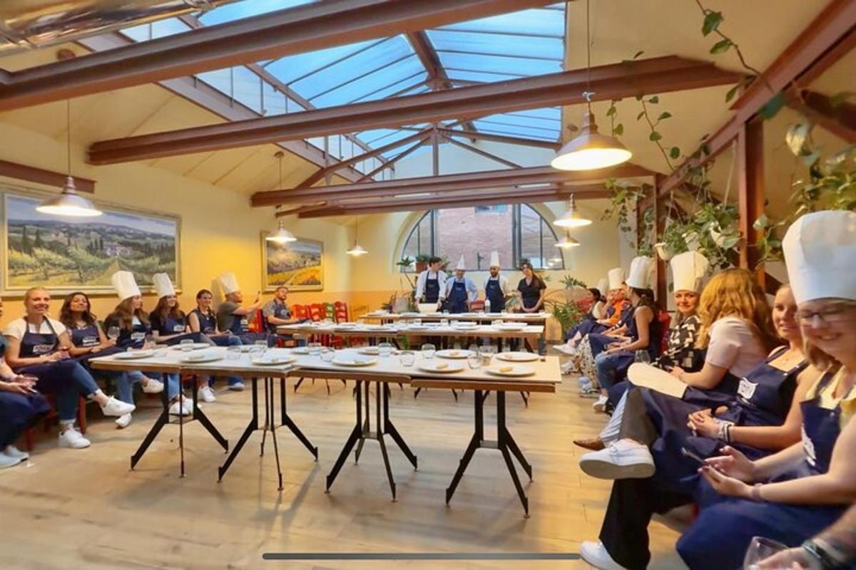 a group of people sitting around tables in a room