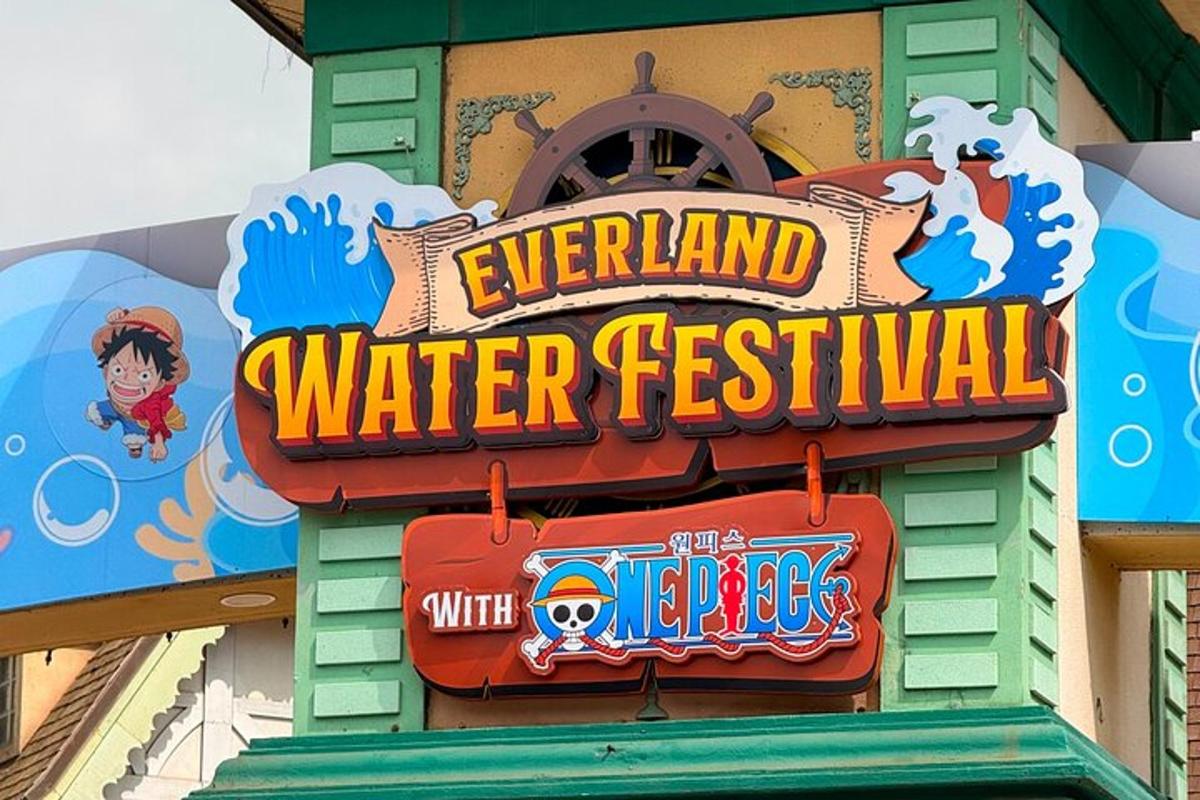 a water festival sign on the side of a building