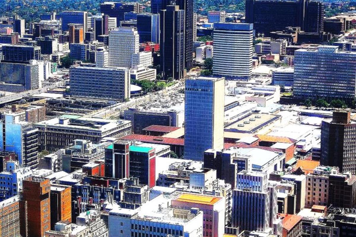an aerial view of a city with tall buildings