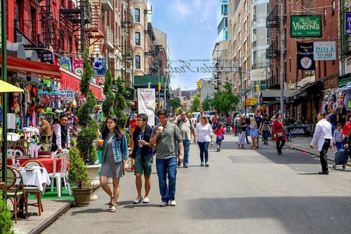 a group of people walking down a busy city street