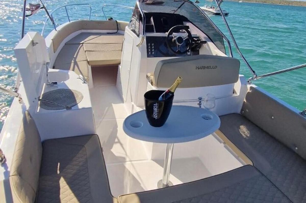 a boat with a table and a bottle on it