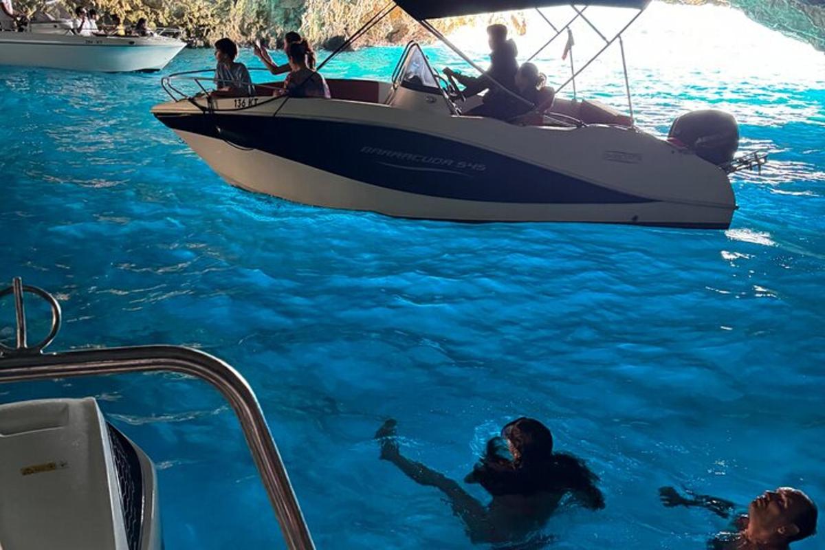 a group of people on a boat in the water
