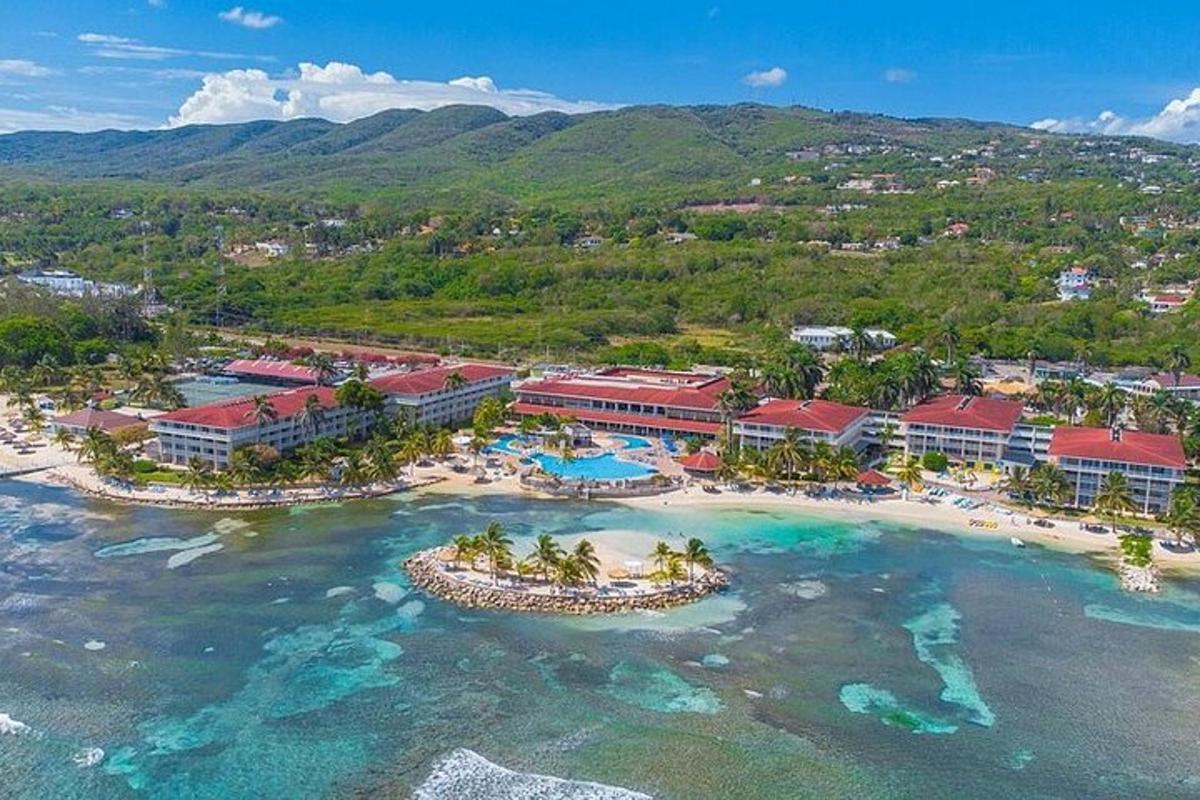 an aerial view of a resort on a beach