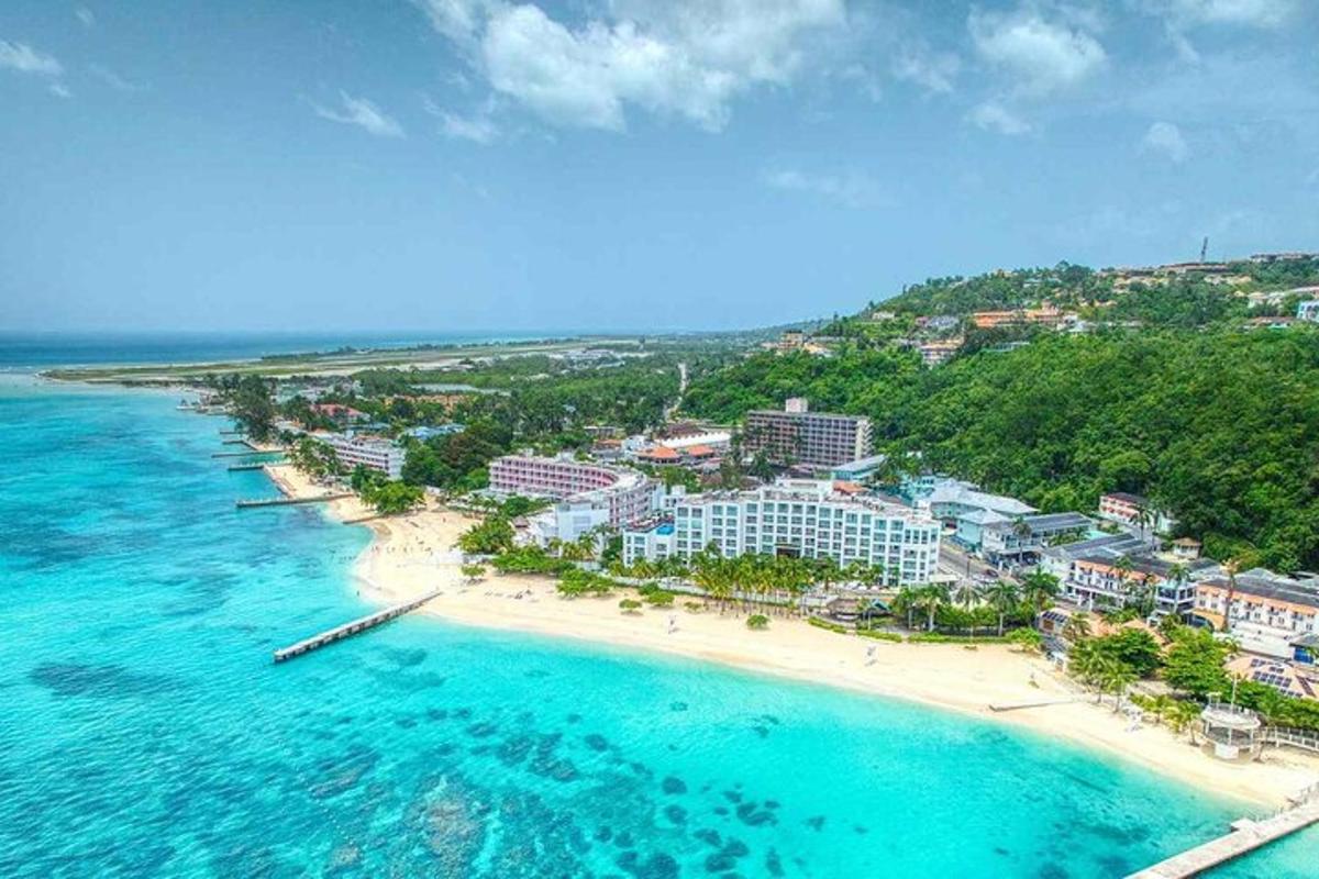 an aerial view of a resort on a beach