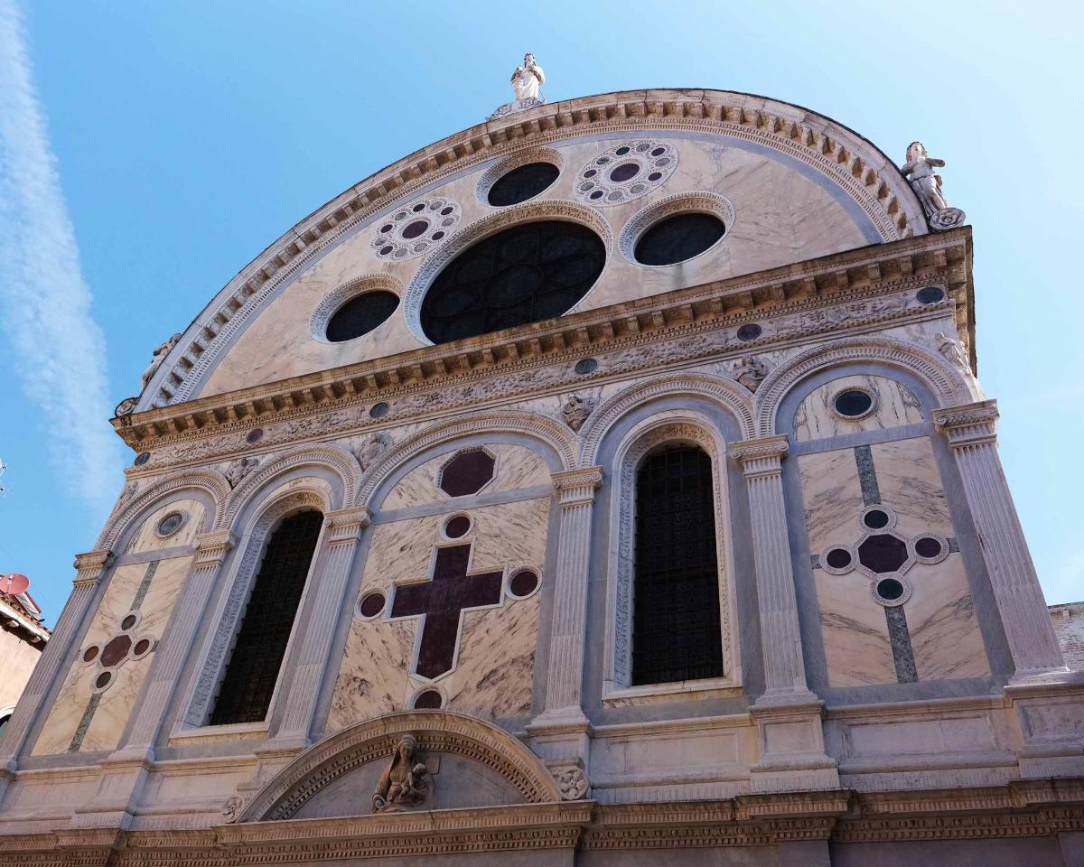 a church tower with a cross on top of it