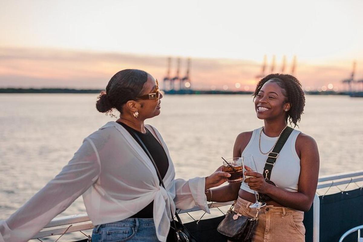 two women standing on a boat with drinks