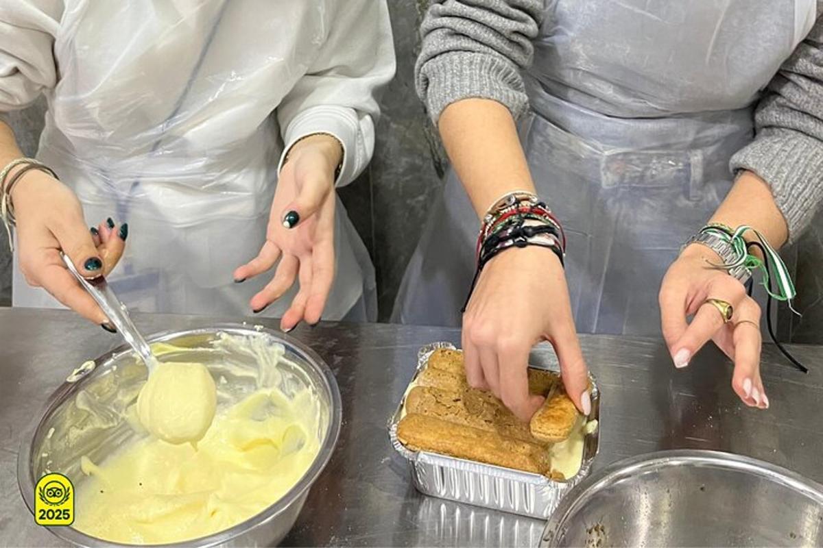 two people standing in a kitchen preparing food