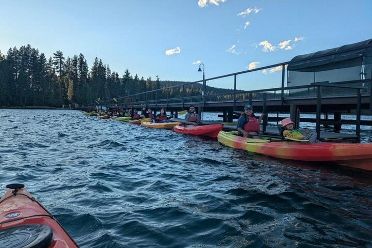 a group of people in kayaks on a river