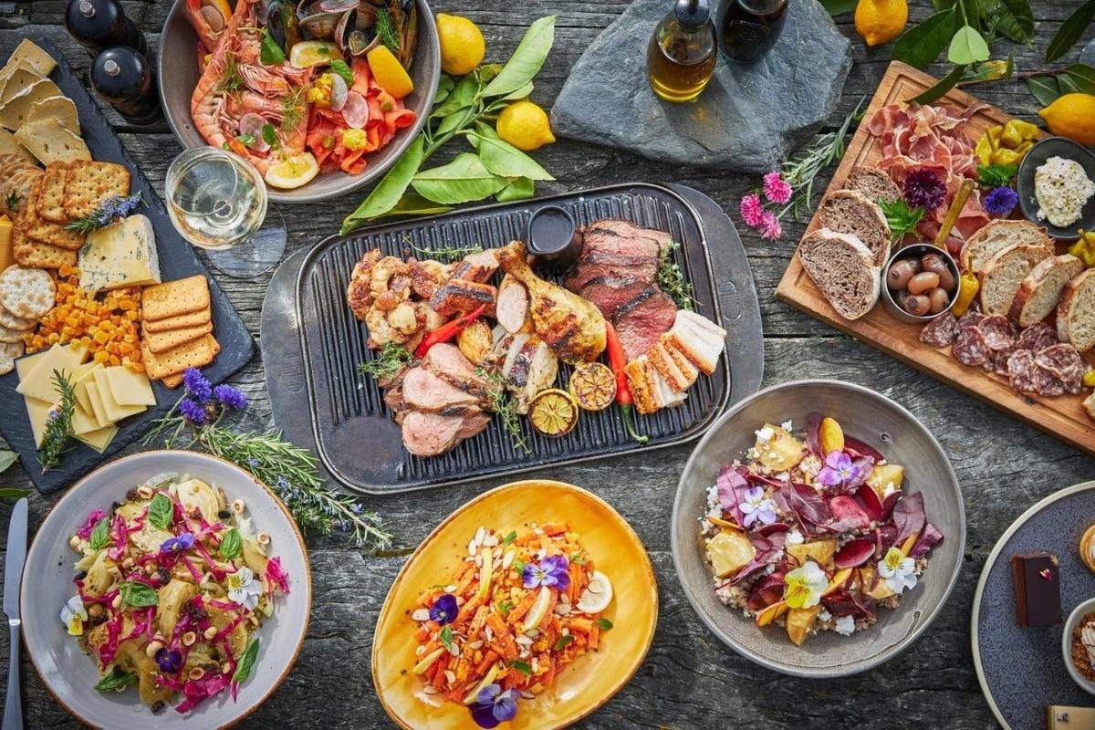 a table full of different types of food on plates