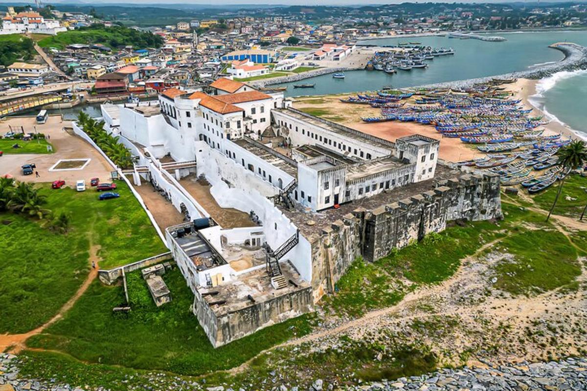 an aerial view of a building next to a harbor