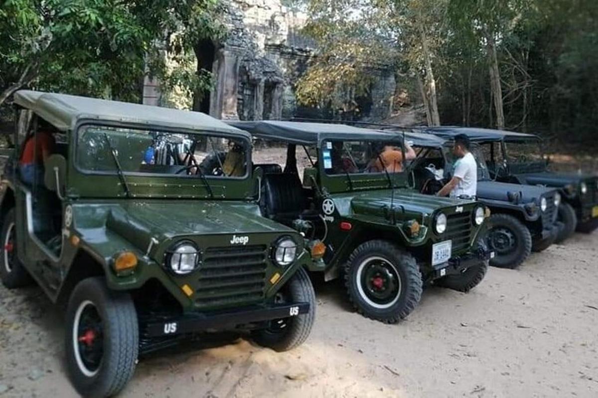 two green jeepneys parked next to each other