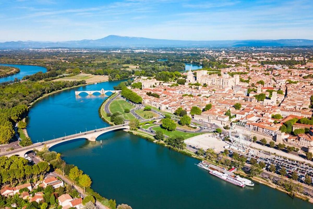 an aerial view of a river and a city