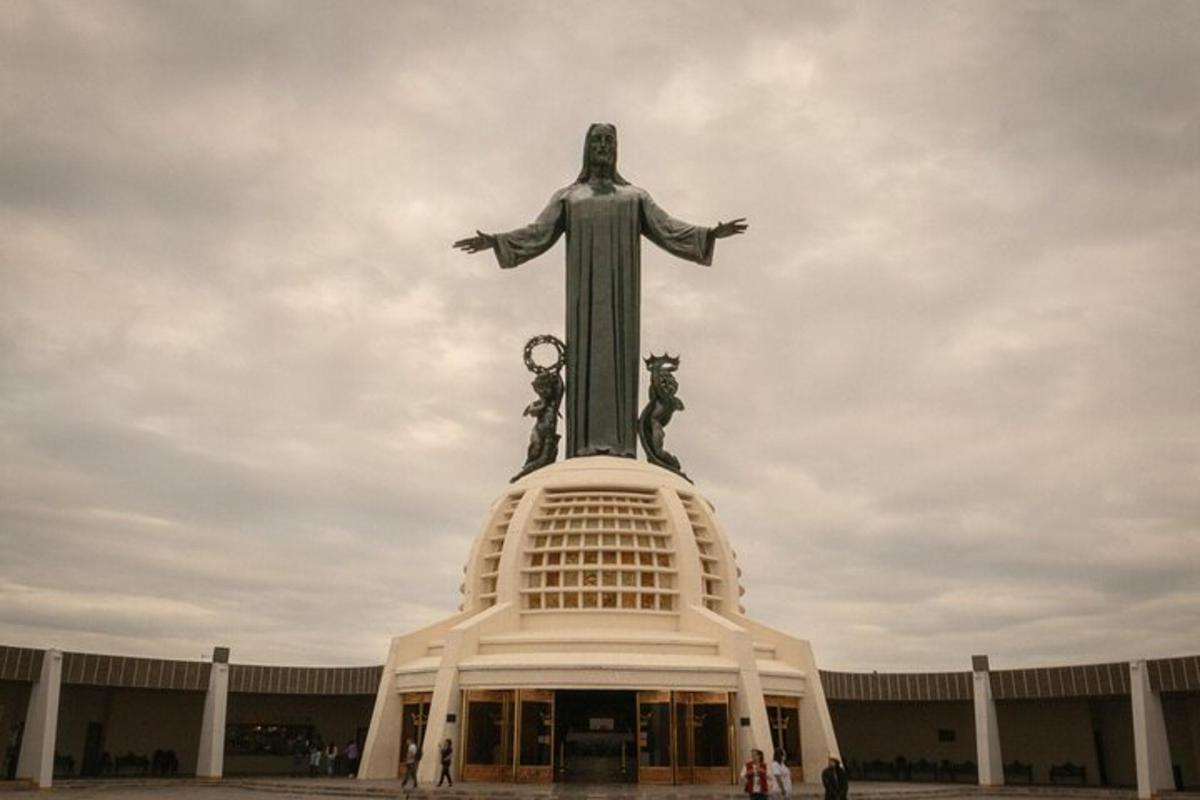 a large statue of christ the redeemer on top of a building