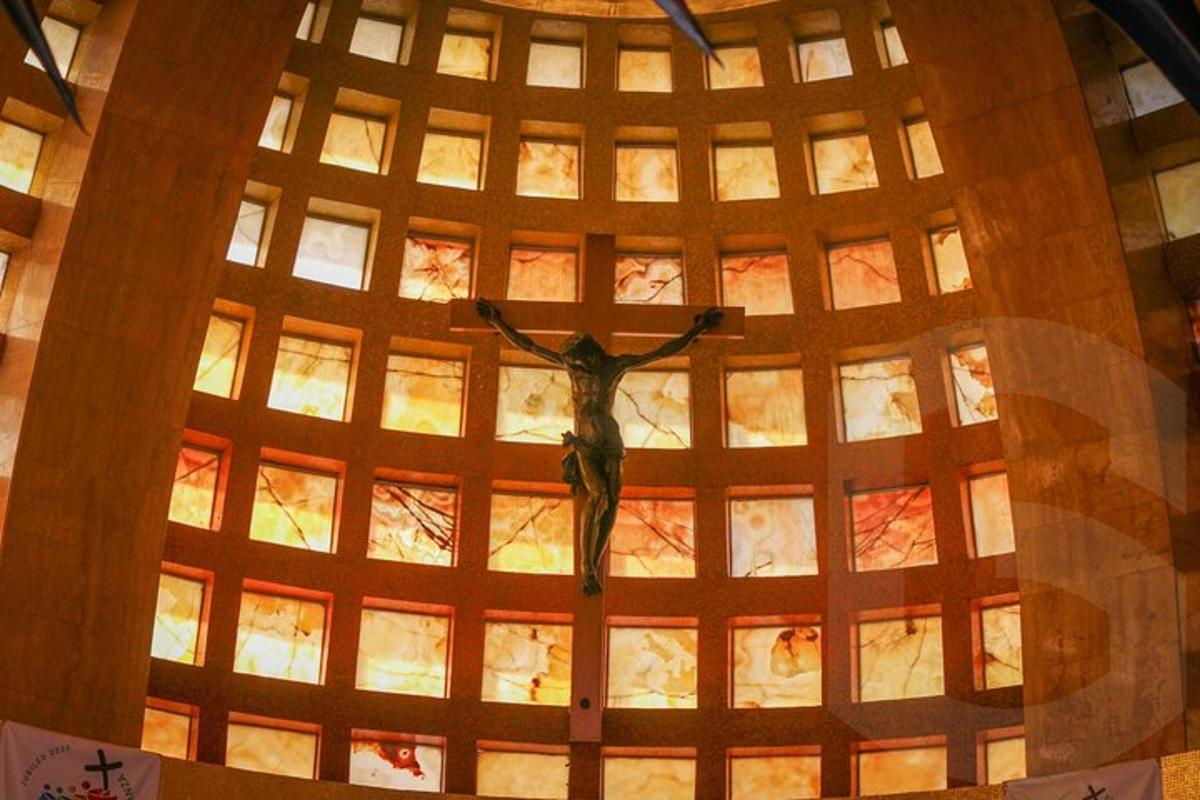 a statue of a woman in the center of a ceiling