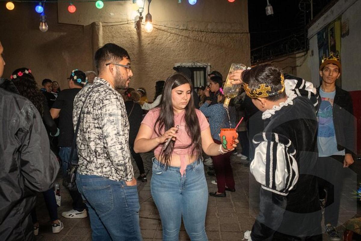 a group of people walking in a crowd at a party