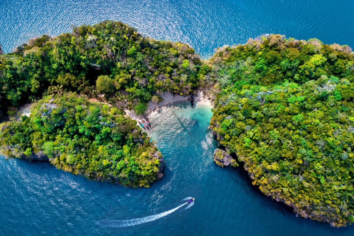 an aerial view of two islands in the water