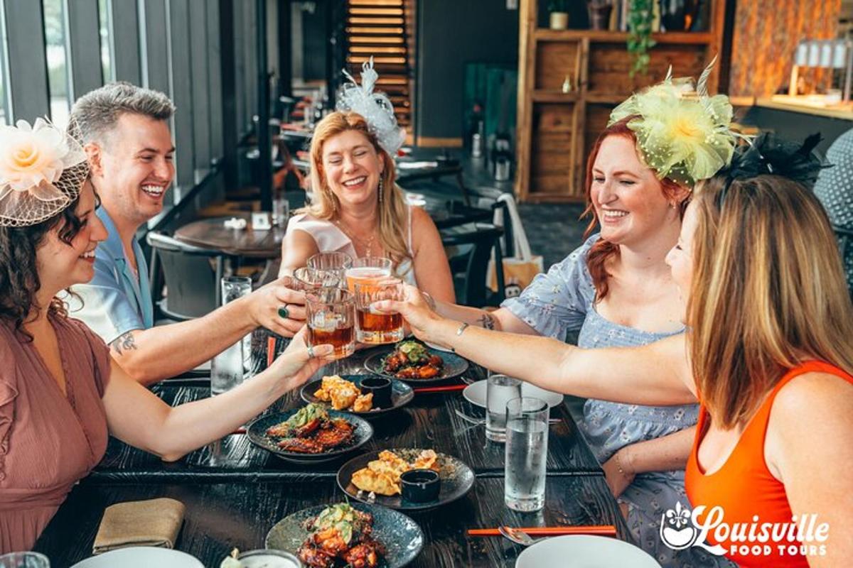 a group of people sitting around a table eating food
