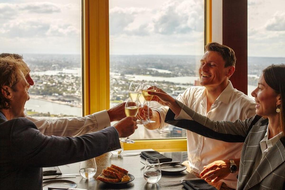 a group of people sitting around a table drinking wine