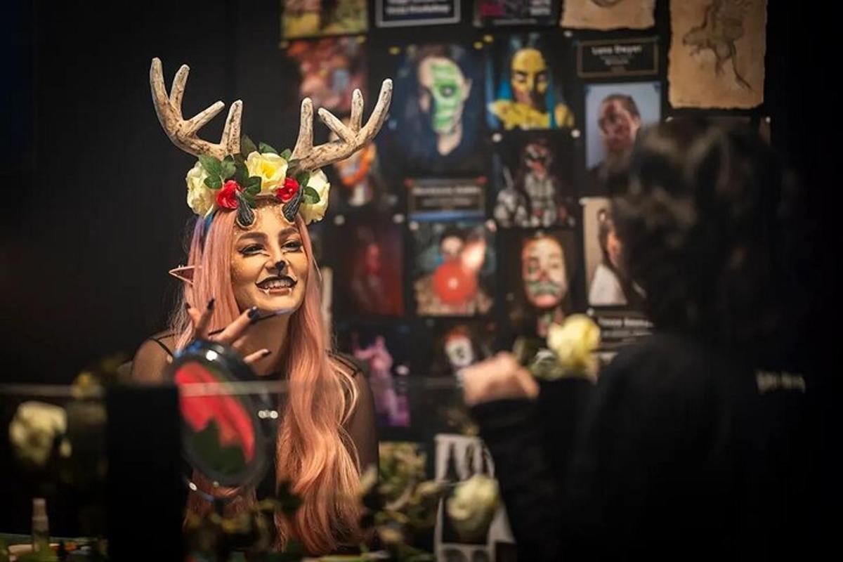 a woman with deer horns on her head in a mirror