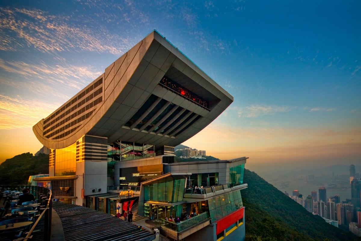 a building on top of a hill with a city