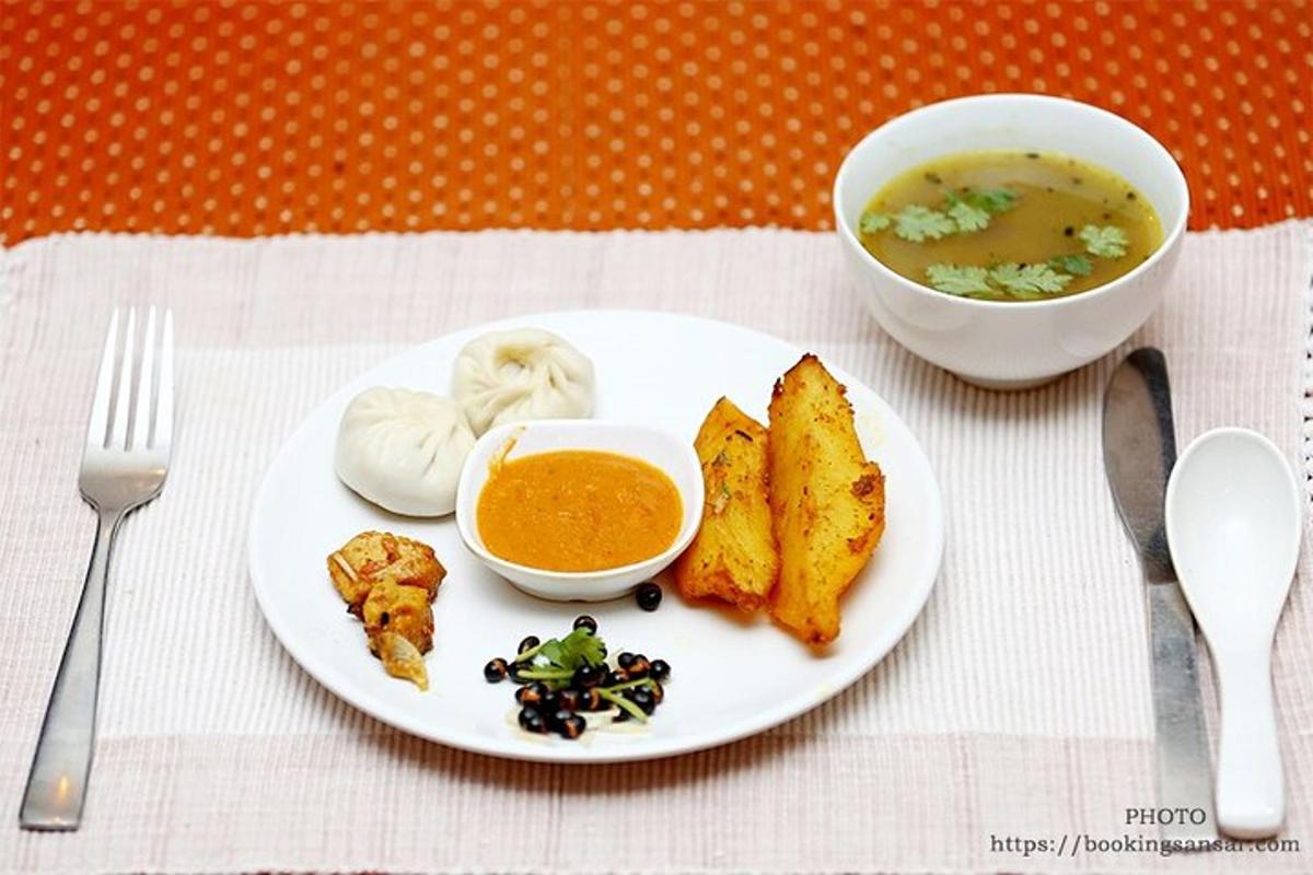 a plate with a bowl of soup and a bowl of food