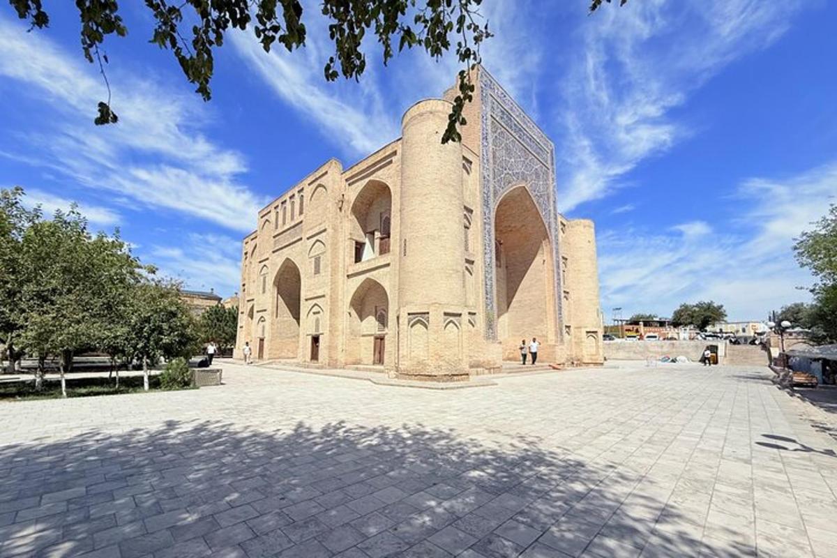 a large brick building with a blue sky